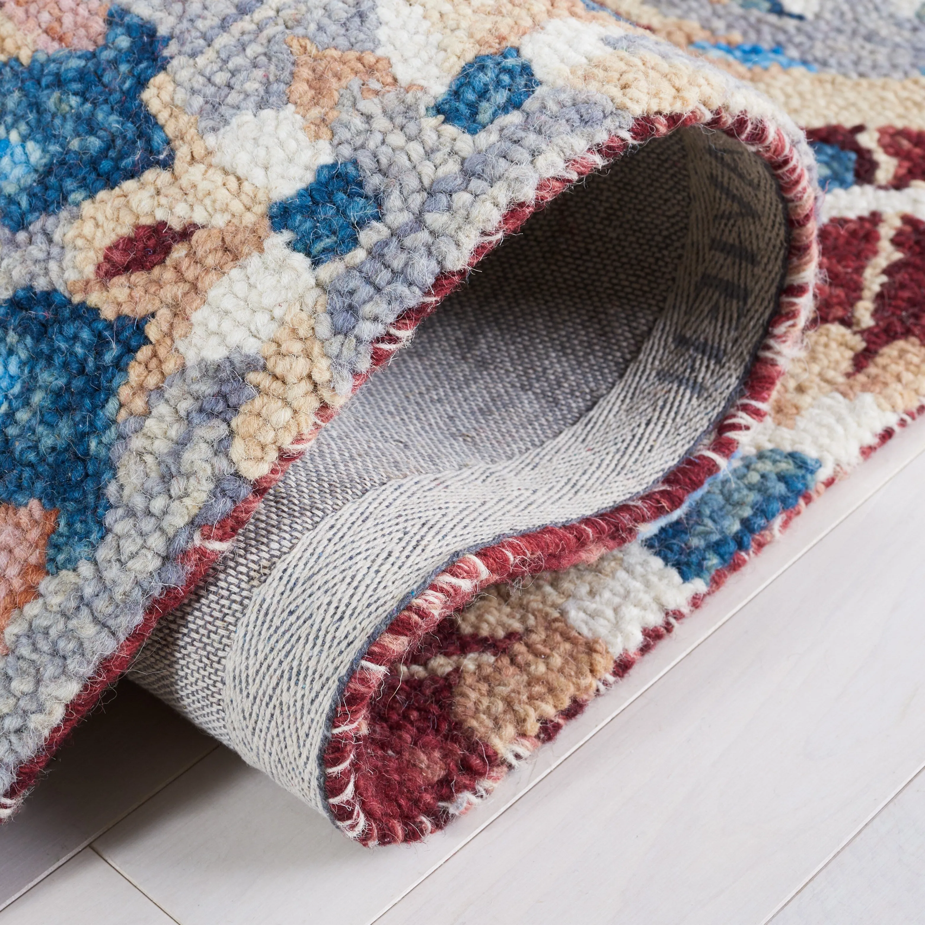 SAFAVIEH Handmade Aspen Orane Floral Braided Tassel Wool Rug