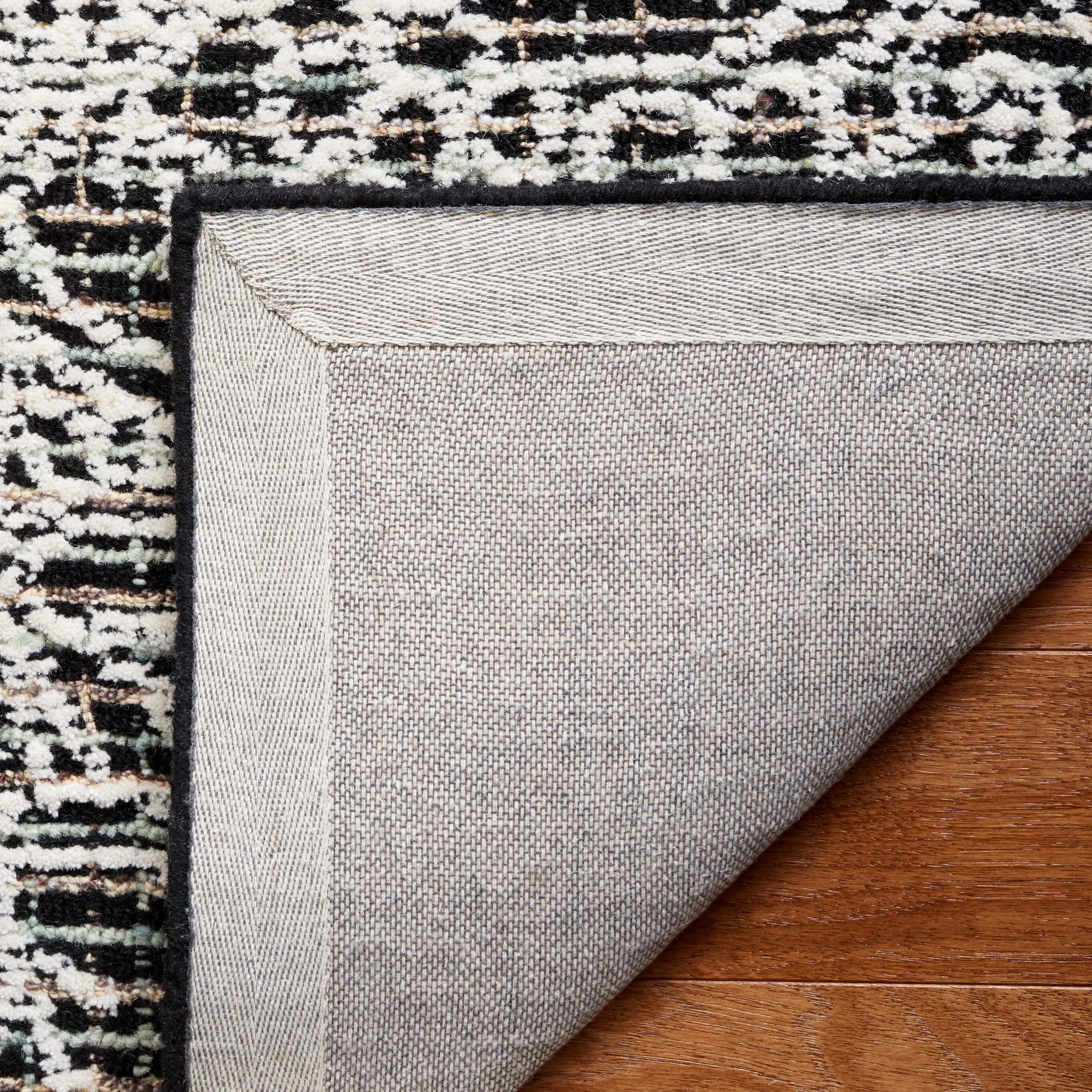 SAFAVIEH Handmade Ebony Dita Modern Floral Wool Rug
