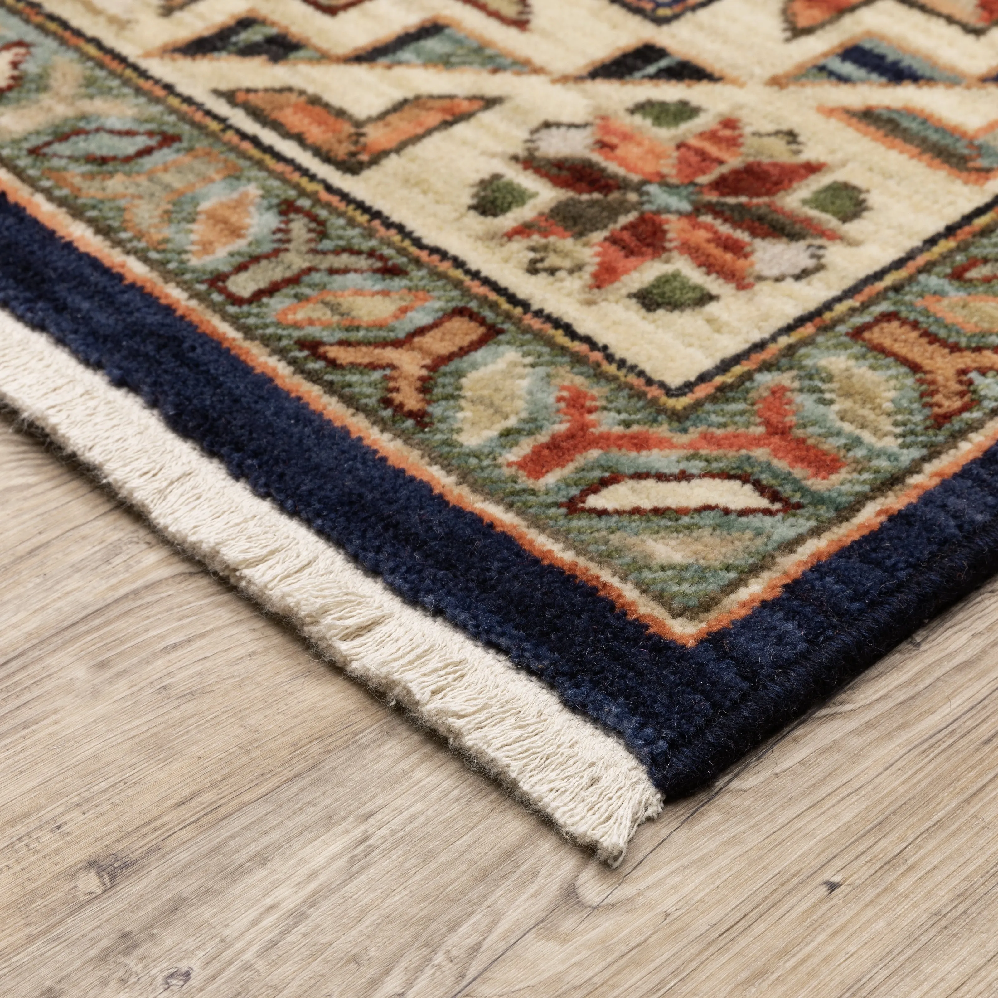 Style Haven Leander Tribal Medallion Navy/ Multi Fringed Wool Blend Area Rug.