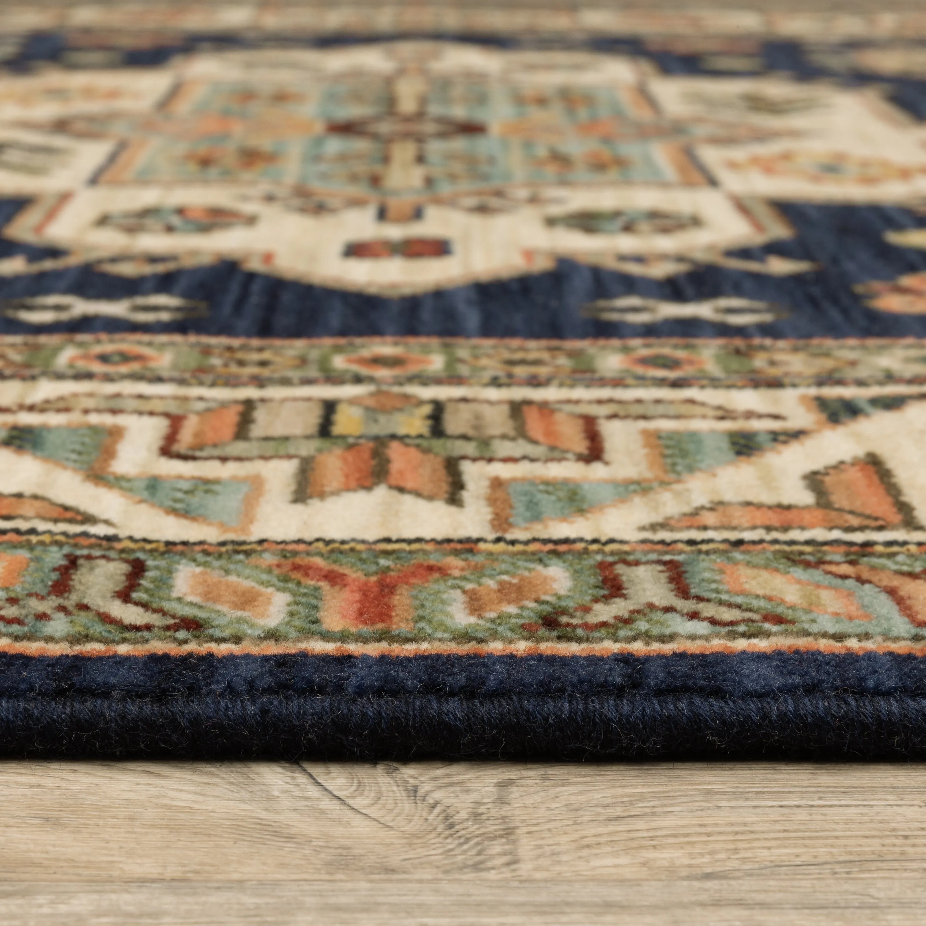 Style Haven Leander Tribal Medallion Navy/ Multi Fringed Wool Blend Area Rug.