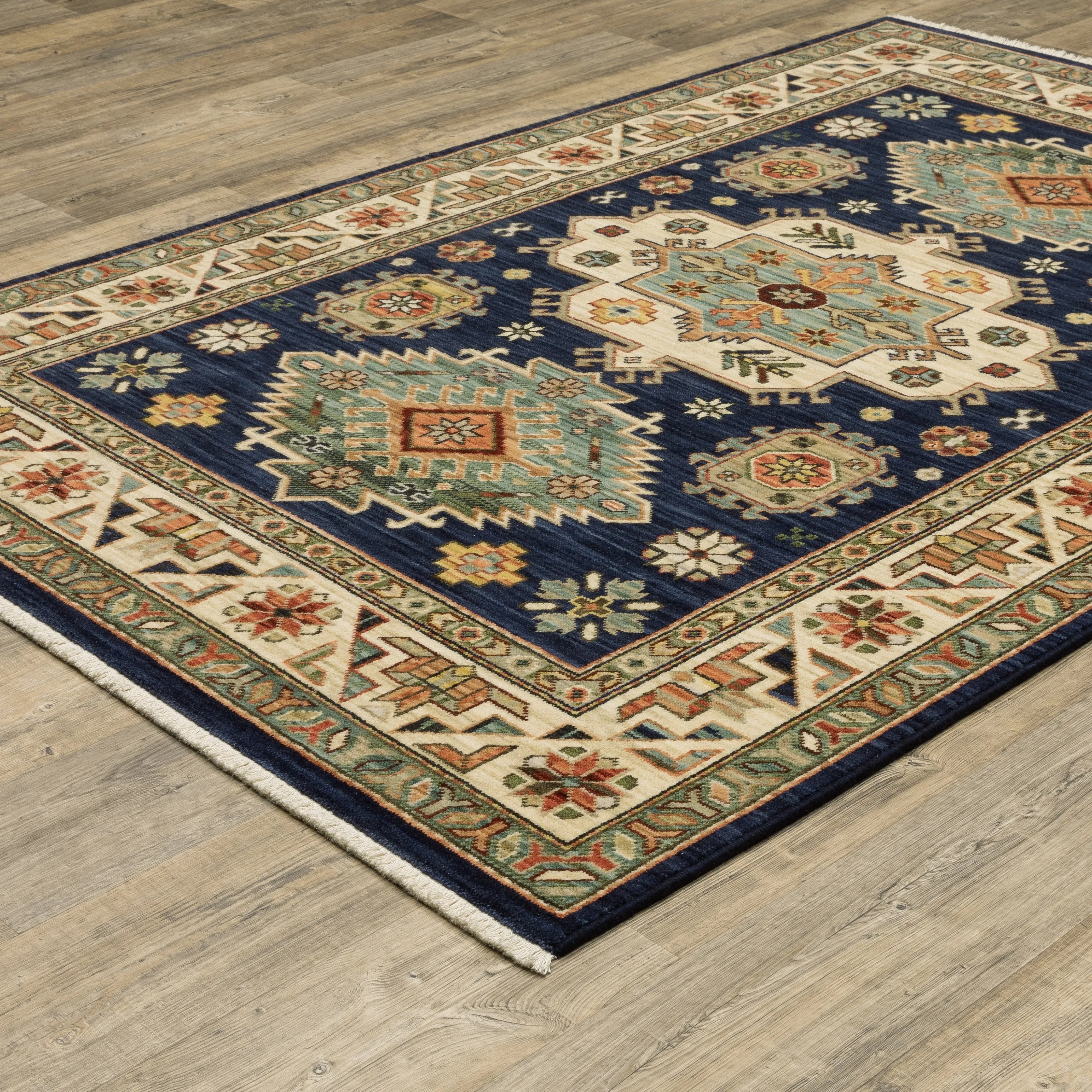 Style Haven Leander Tribal Medallion Navy/ Multi Fringed Wool Blend Area Rug.