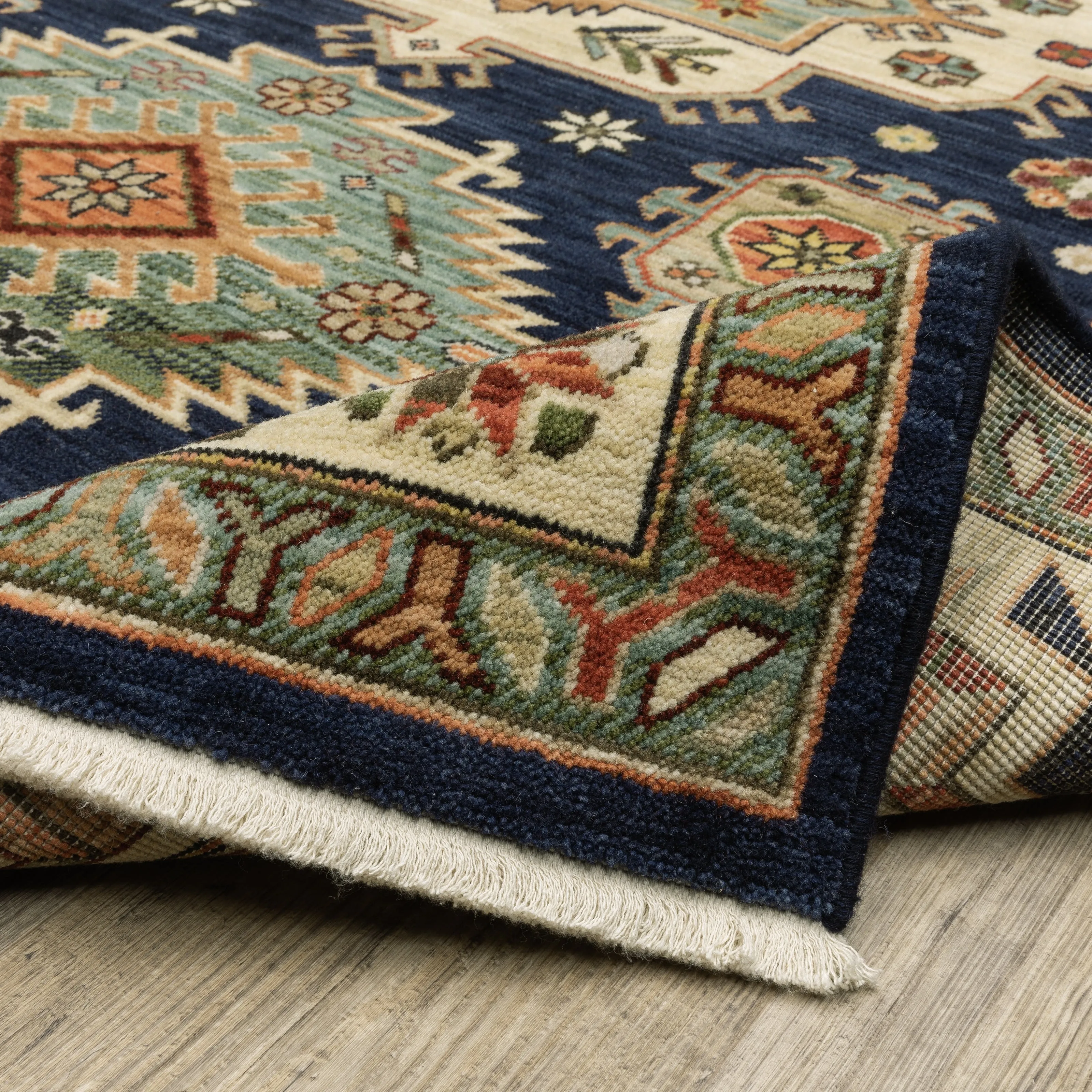 Style Haven Leander Tribal Medallion Navy/ Multi Fringed Wool Blend Area Rug.