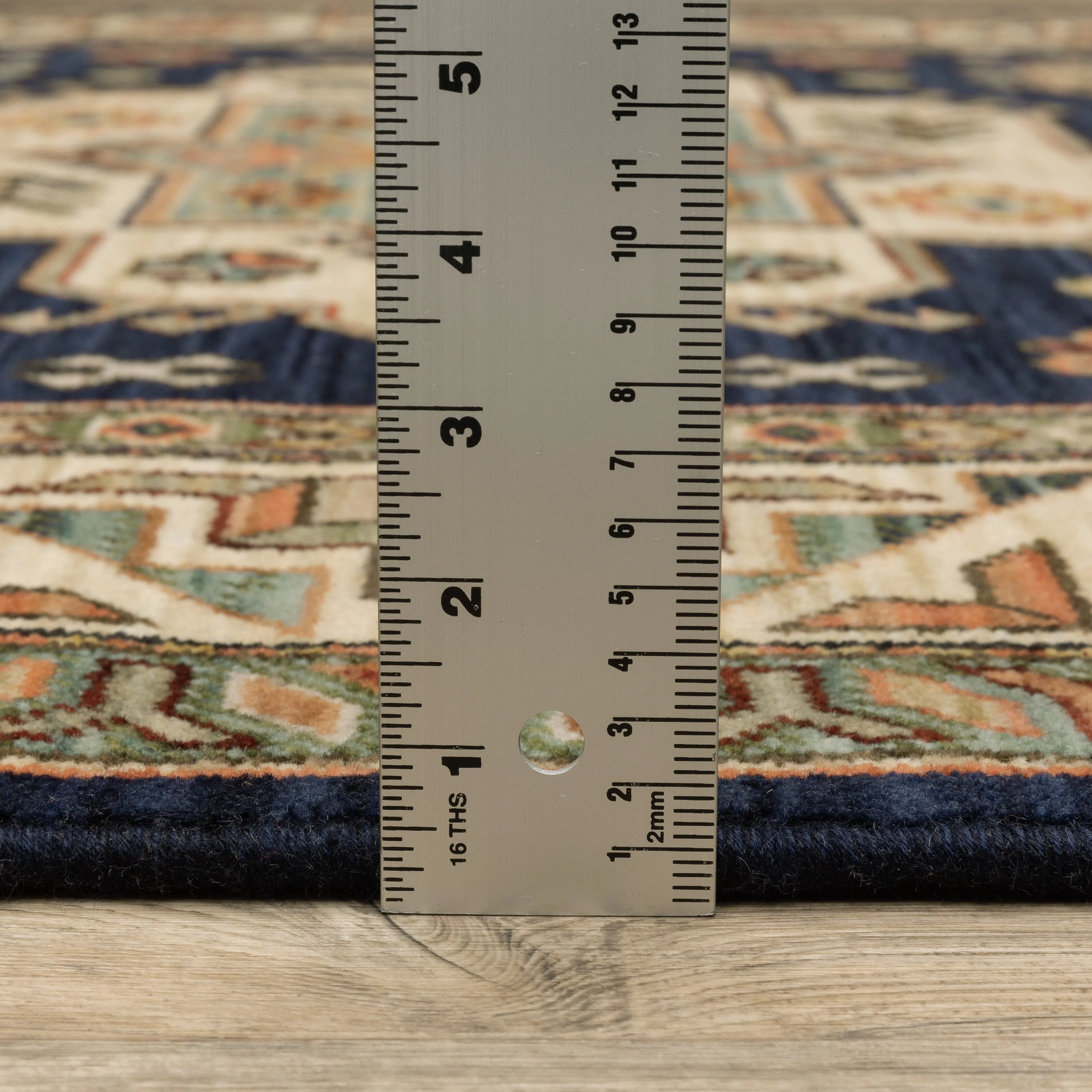 Style Haven Leander Tribal Medallion Navy/ Multi Fringed Wool Blend Area Rug.