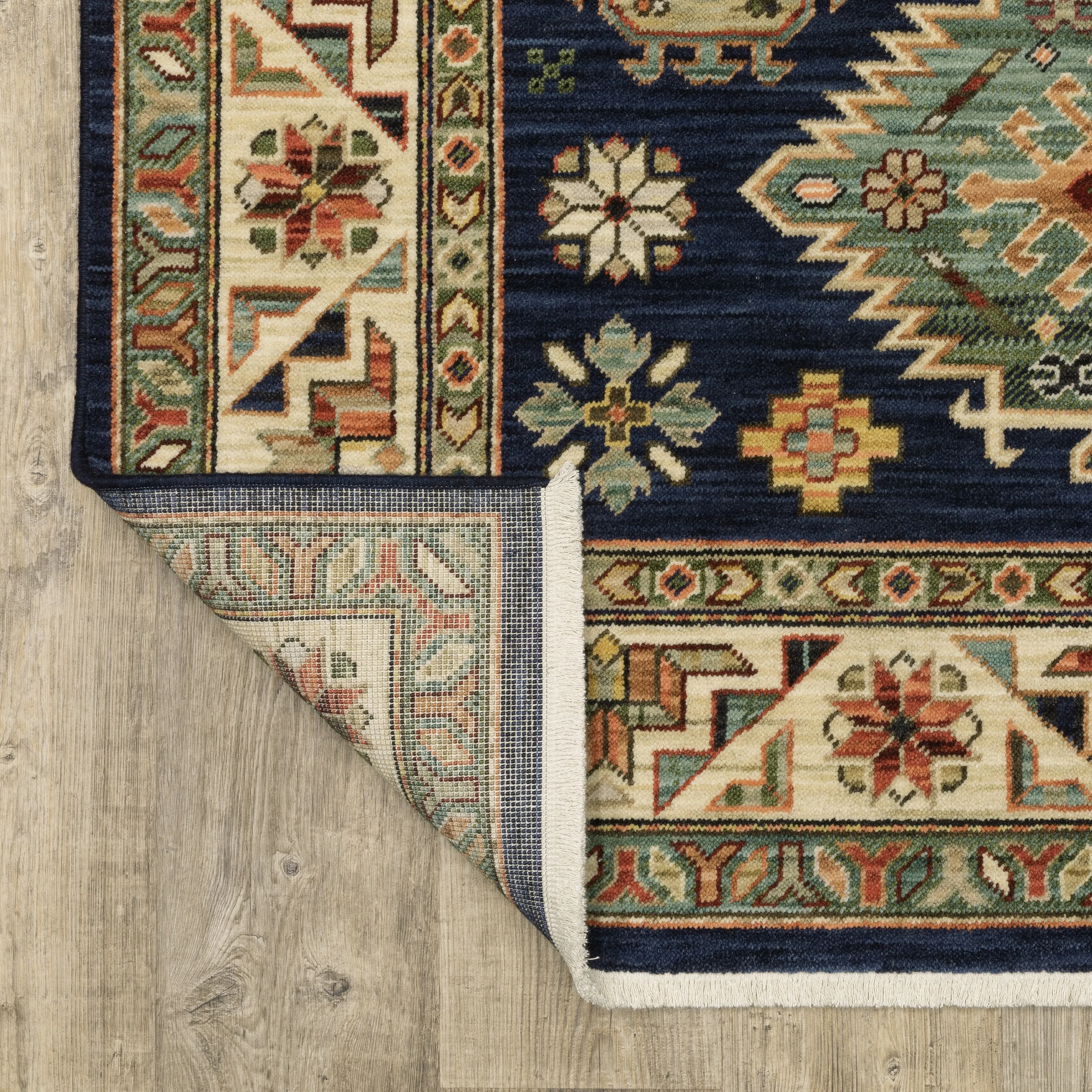Style Haven Leander Tribal Medallion Navy/ Multi Fringed Wool Blend Area Rug.
