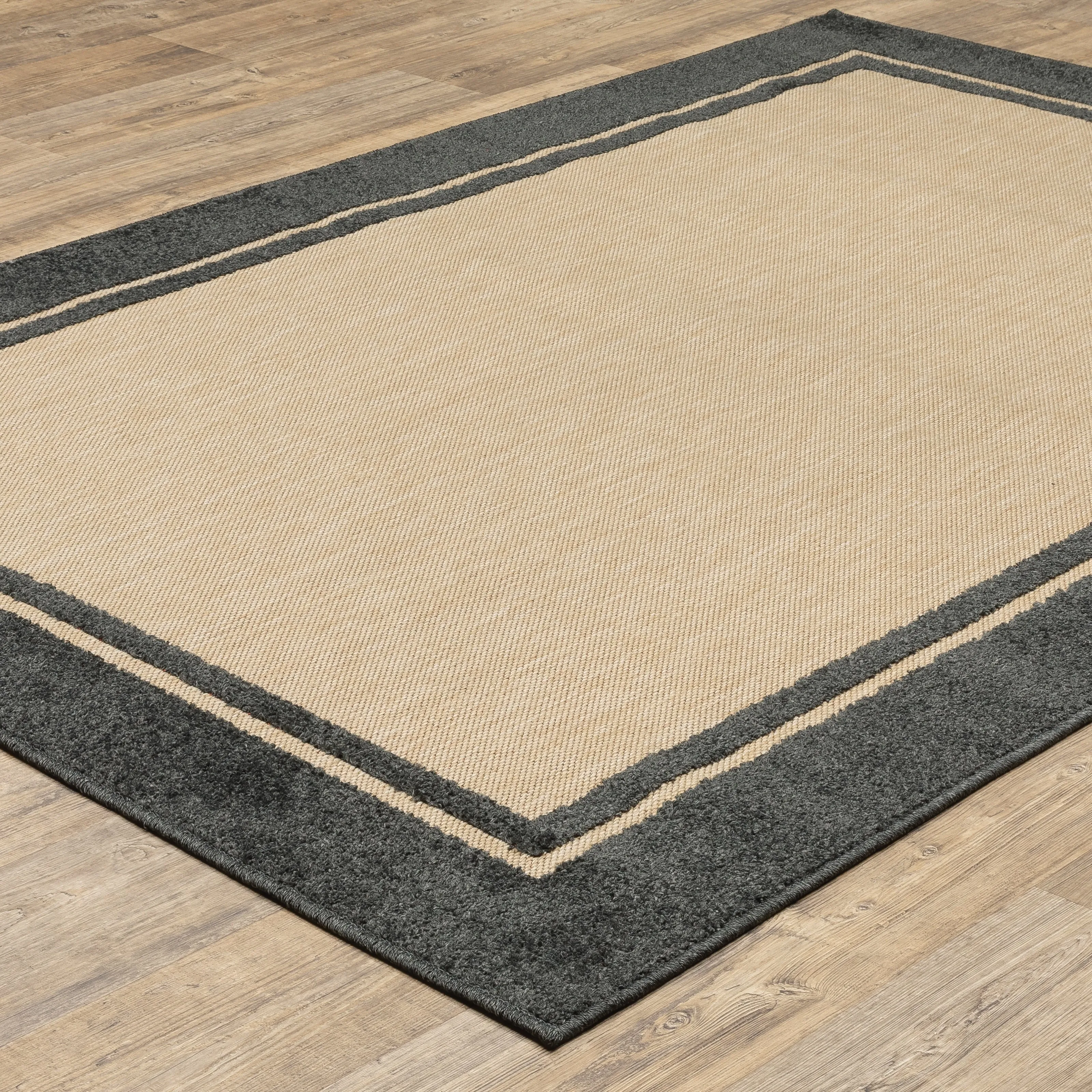 Vista Home Capri Mixed Pile Bordered Black/Tan Indoor-Outdoor Area Rug.
