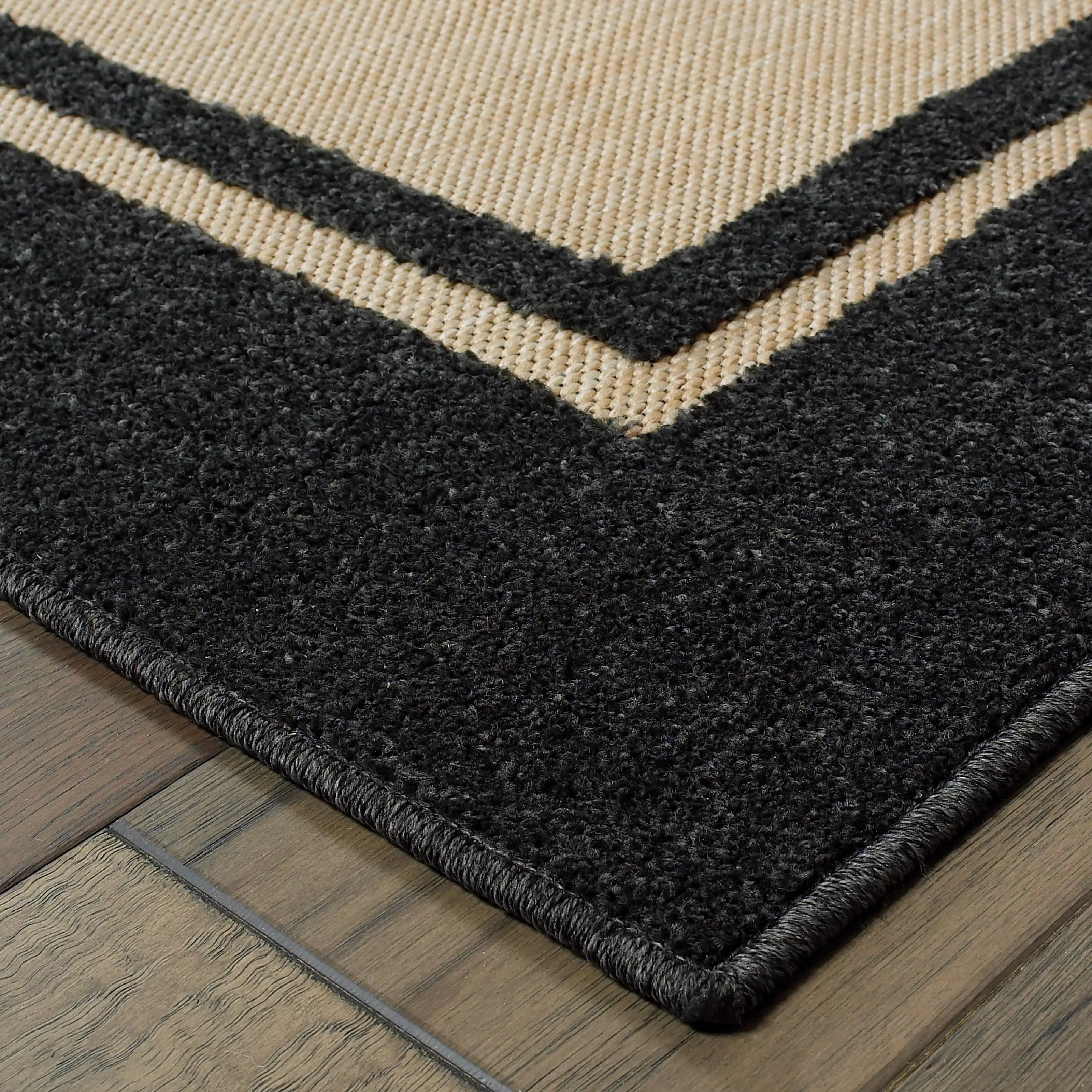 Vista Home Capri Mixed Pile Bordered Black/Tan Indoor-Outdoor Area Rug.