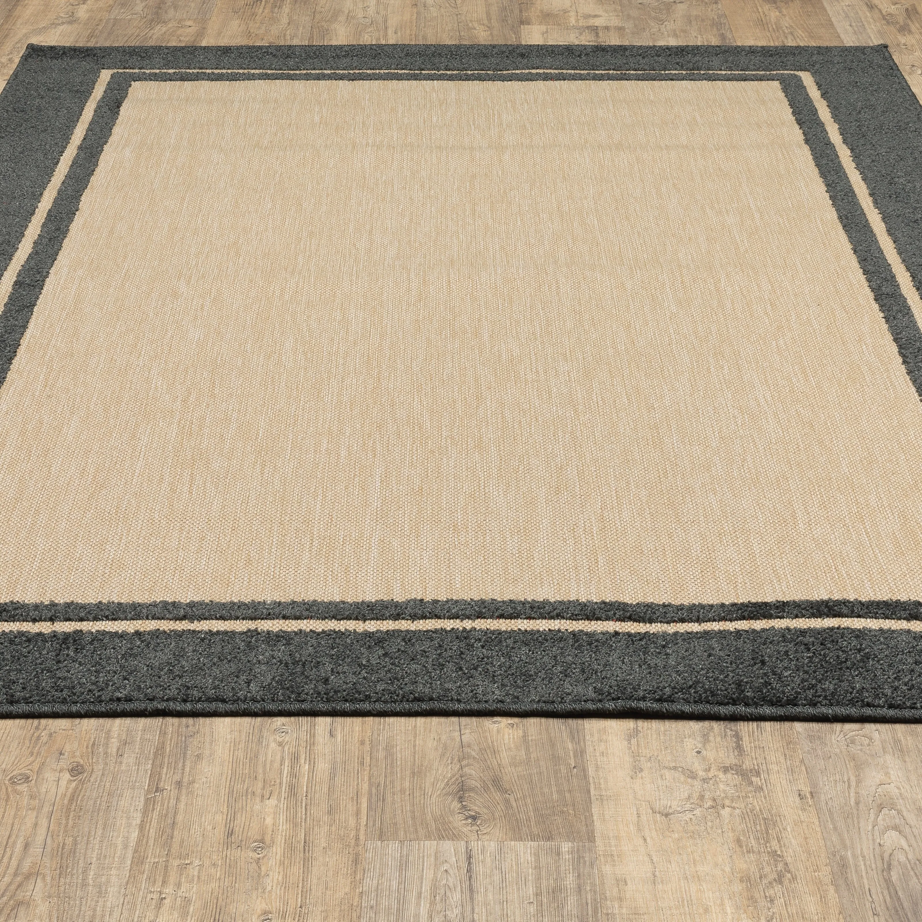 Vista Home Capri Mixed Pile Bordered Black/Tan Indoor-Outdoor Area Rug.