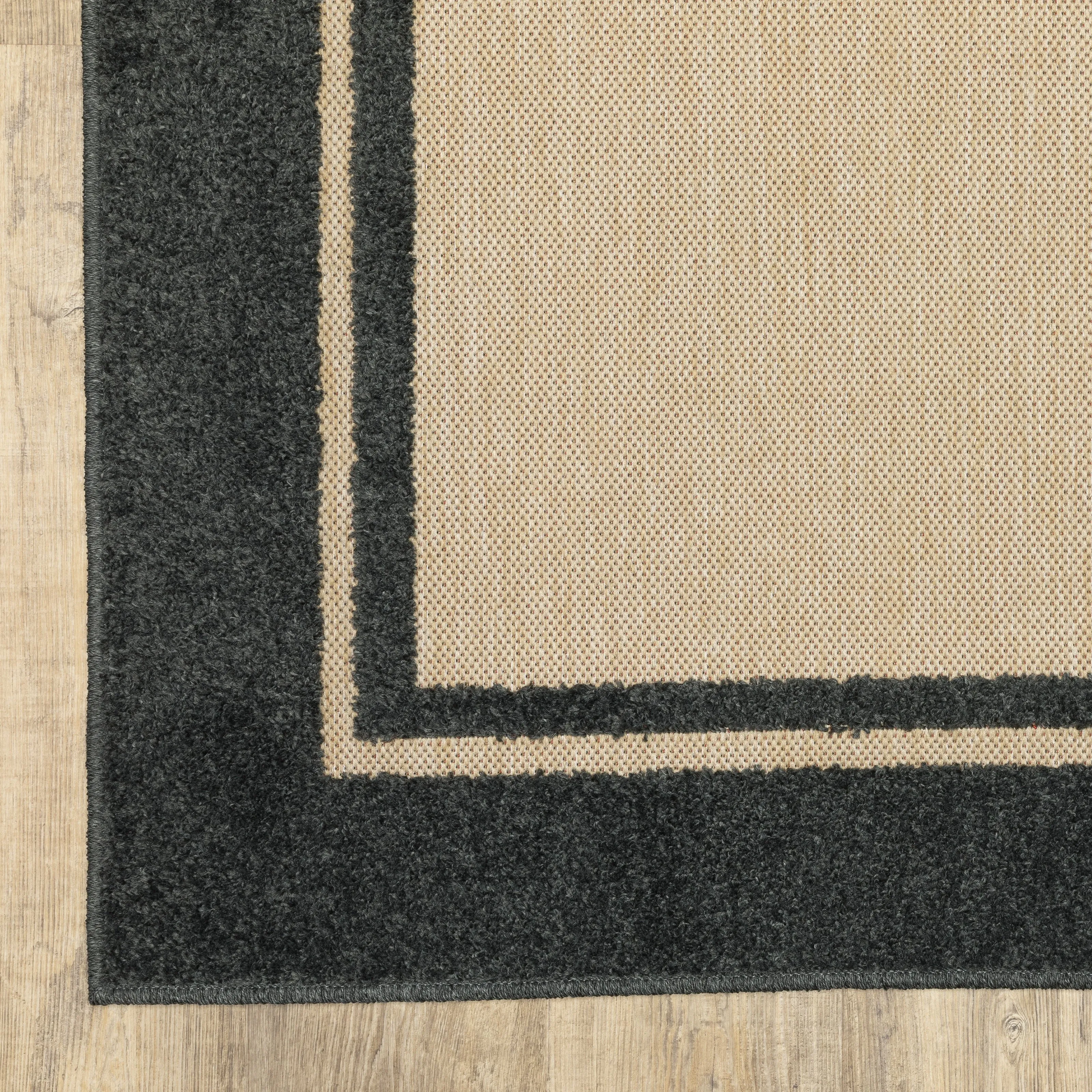 Vista Home Capri Mixed Pile Bordered Black/Tan Indoor-Outdoor Area Rug.